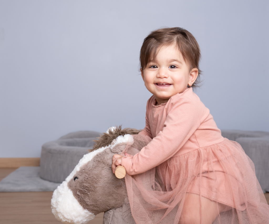 Toddler showing signs of nursery readiness through independent play at a child-led nursery in Al Safa Dubai.